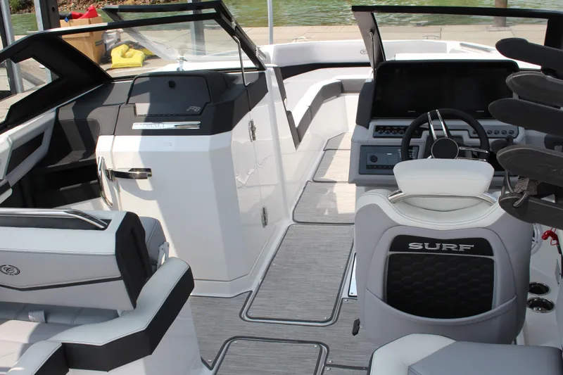 Slide: The Image of 2025 Cobalt R8 Surf boat interior with modern dashboard and seating. - 17