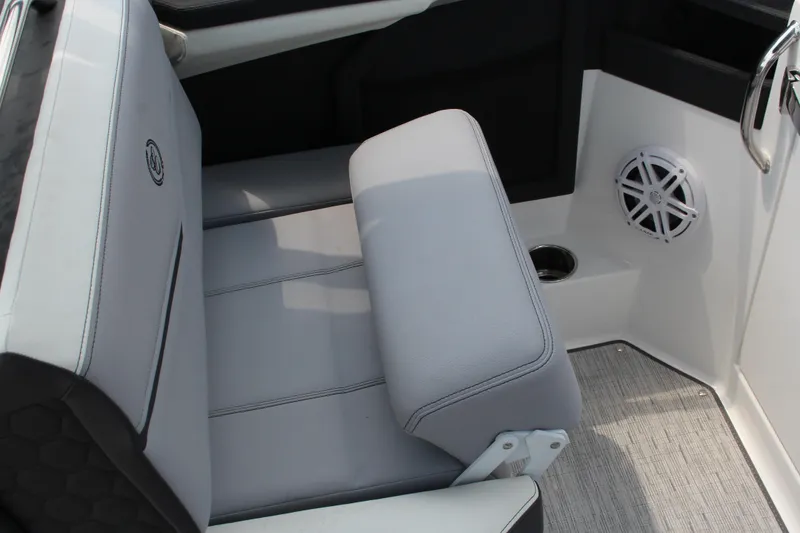 Slide: The Image of 2025 Cobalt R8 Surf boat interior with gray seating and speaker detail. - 18