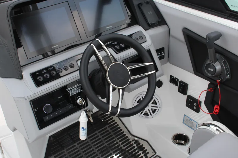 Slide: The Image of 2025 Cobalt R8 Surf boat dashboard with steering wheel and control panel. - 20