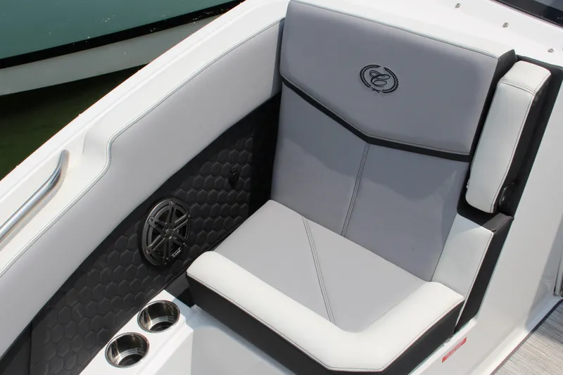 Slide: The Image of 2025 Cobalt R8 Surf boat interior with gray seating and cup holders. - 34