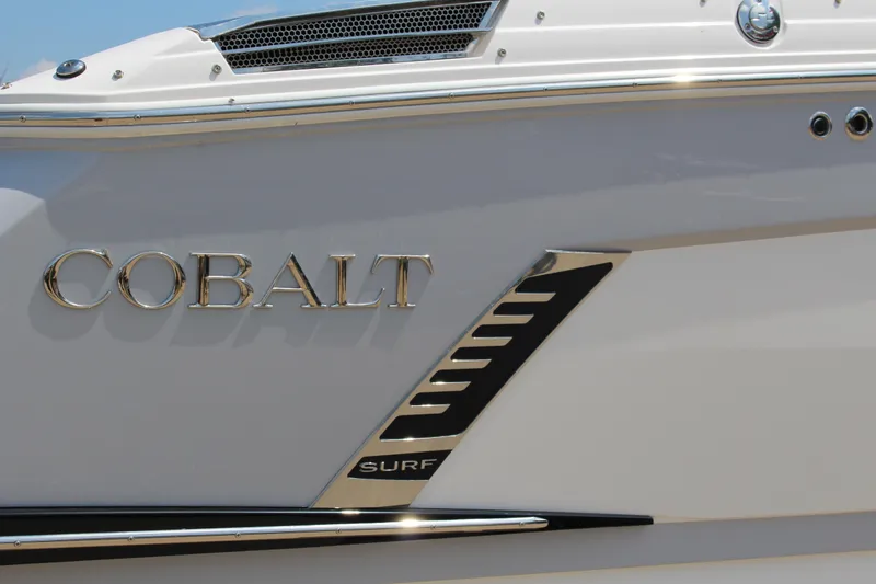 Slide: The Image of 2025 Cobalt R8 Surf boat with sleek chrome detailing. - 43