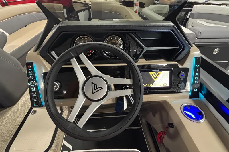 Slide: The Image of Viaggio Z24U 2026 boat dashboard with steering wheel and digital display. - 9