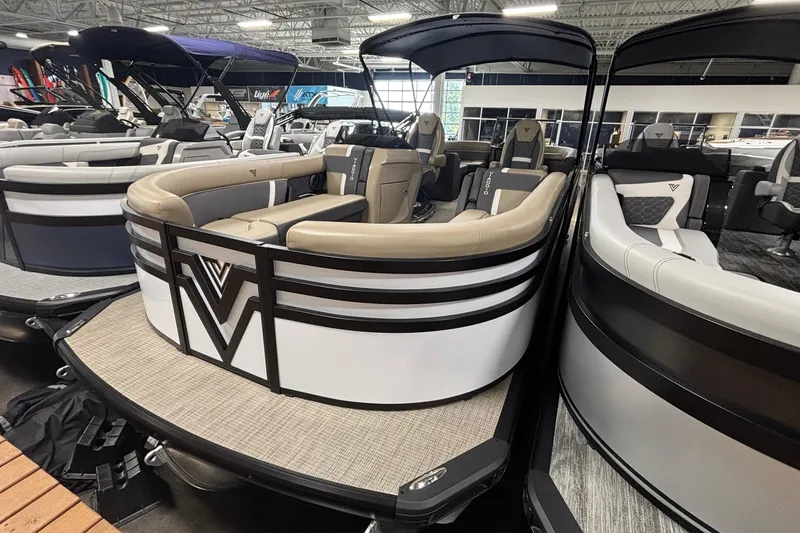 The Image of 2026 Viaggio Z24U pontoon boat with luxurious seating in a showroom. - 1