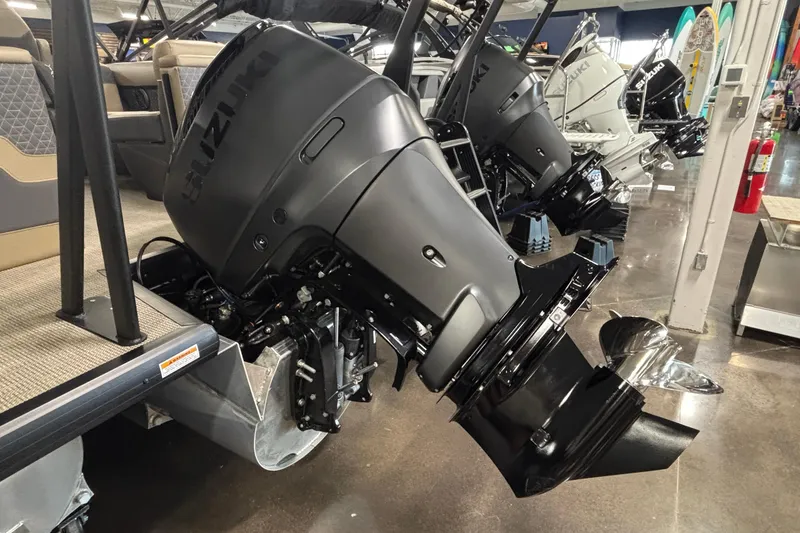 Slide: The Image of Outboard motors on a Viaggio Z24U boat, 2026 model, in a showroom setting. - 4