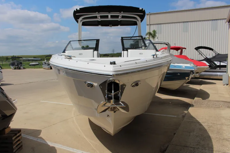 Slide: The Image of 2025 Cobalt R8 boat displayed outdoors, showcasing sleek design and modern features. - 14