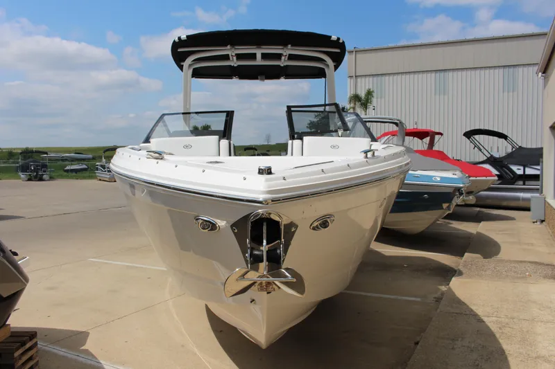Slide: The Image of 2025 Cobalt R8 boat displayed outdoors, showcasing sleek design and modern features. - 2