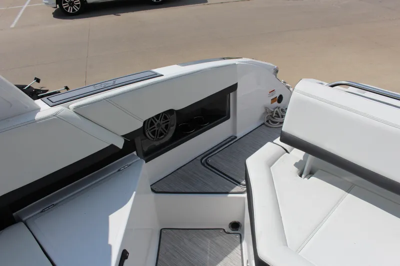 Slide: The Image of 2025 Cobalt R8 boat interior with white seating and modern design elements. - 5