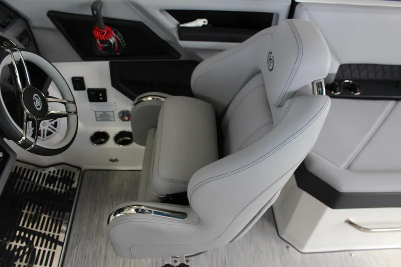 Slide: The Image of 2025 Cobalt R8 boat interior with steering wheel and luxurious seating. - 15