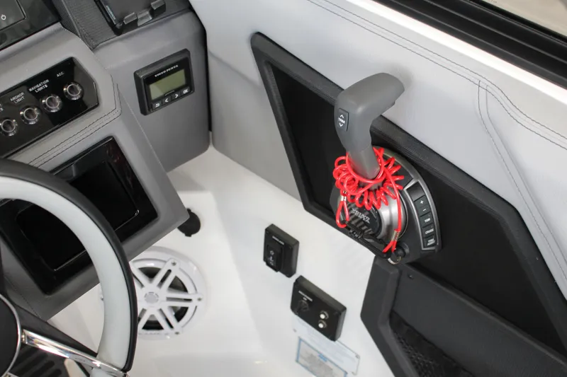Slide: The Image of 2025 Cobalt R8 boat cockpit with steering wheel and control panel. - 18