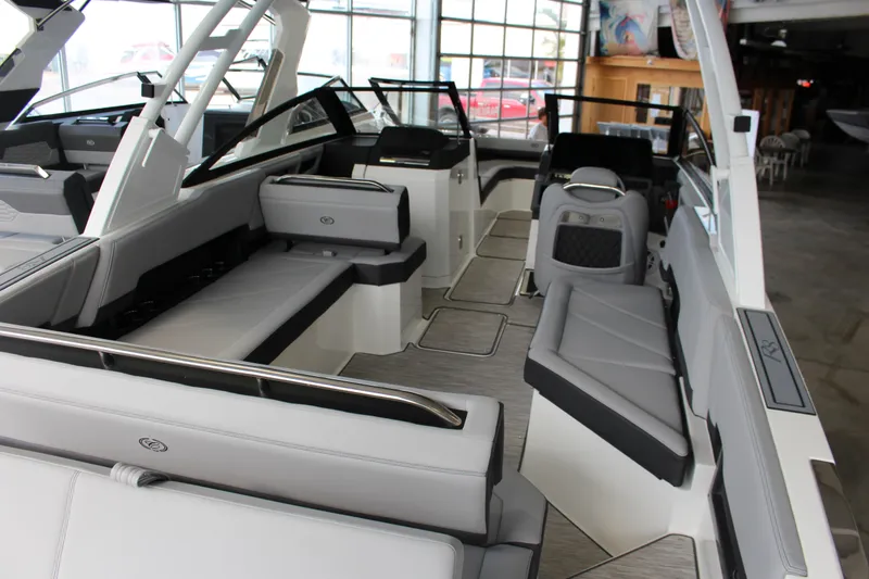 Slide: The Image of 2025 Cobalt R8 boat interior with sleek gray seating and modern design. - 2