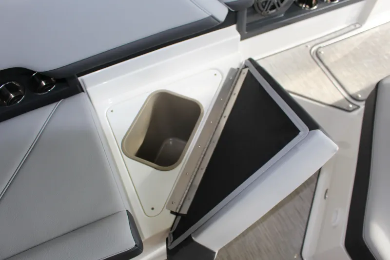 Slide: The Image of 2025 Cobalt R8 boat interior with open storage compartment and seating. - 21