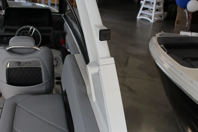 Slide: The Image of Interior of 2025 Cobalt R8 boat with gray seating and steering wheel. - 26