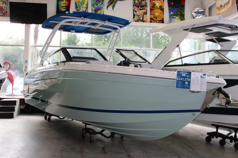 Slide: The Image of 2025 Cobalt R8 boat displayed in showroom with price tag. - 29