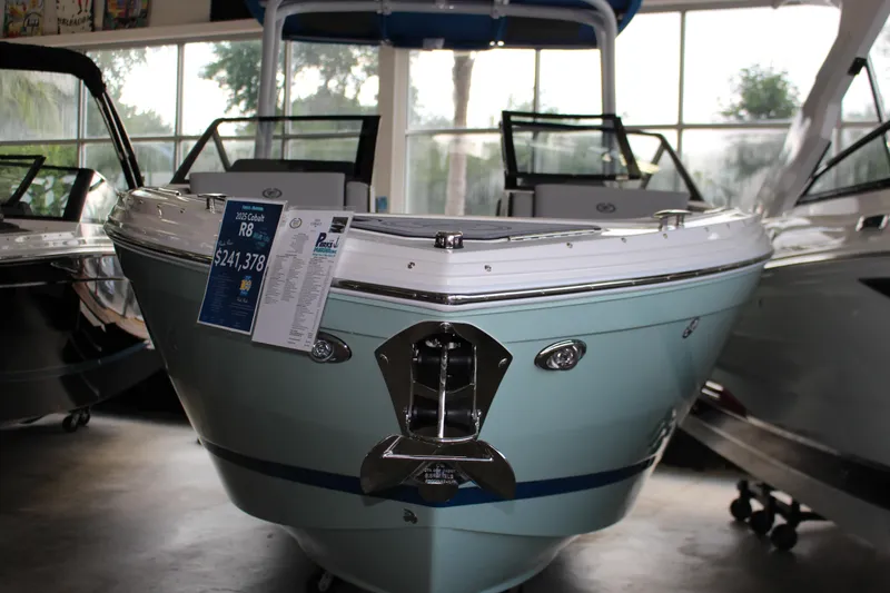 Slide: The Image of 2025 Cobalt R8 boat displayed in showroom, priced at $241,378. - 30