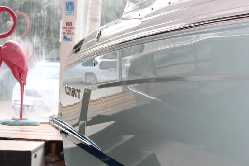 Slide: The Image of 2025 Cobalt R8 boat with sleek design, reflected in showroom, pink flamingo decor. - 32