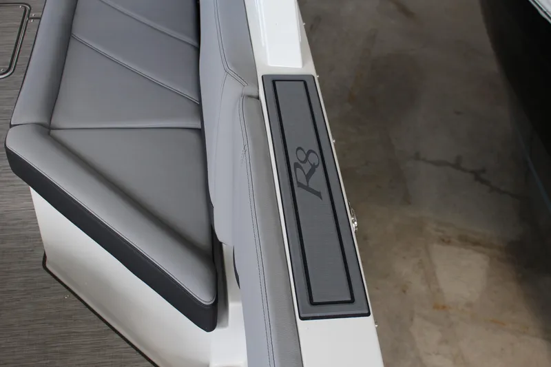 Slide: The Image of 2025 Cobalt R8 boat interior with sleek gray seating and R8 logo detail. - 4