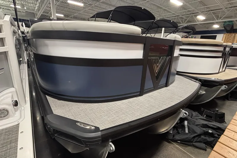 The Image of 2026 Viaggio D22U pontoon boat in showroom, featuring sleek design and modern finishes. - 1