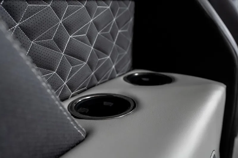Slide: The Image of Luxurious interior of 2026 Viaggio D22U with geometric stitching and dual cup holders. - 11