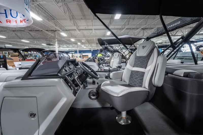 Slide: The Image of Interior of 2026 Viaggio D22U boat showcasing modern steering and seating design. - 18