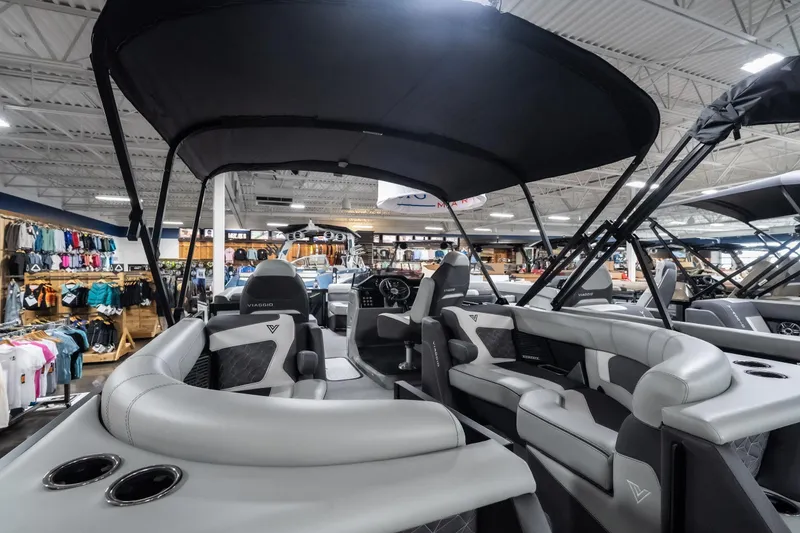 Slide: The Image of 2026 Viaggio D22U boat interior with sleek seating and canopy in showroom. - 27