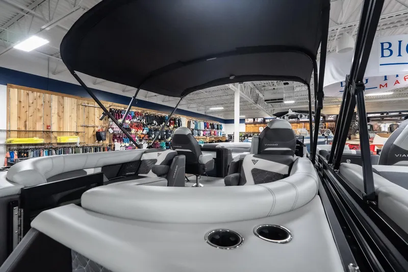 Slide: The Image of 2026 Viaggio D22U boat interior with sleek seating and canopy in showroom. - 29