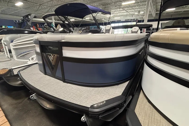 Slide: The Image of 2026 Viaggio D22U pontoon boat displayed in a showroom with modern seating. - 3