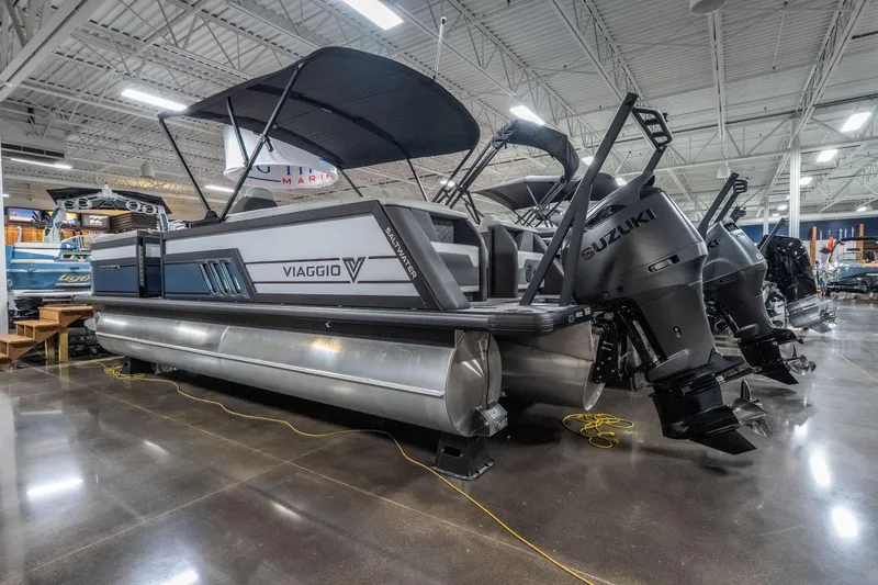 Slide: The Image of 2026 Viaggio D22U pontoon boat with Suzuki outboard motors in showroom. - 32