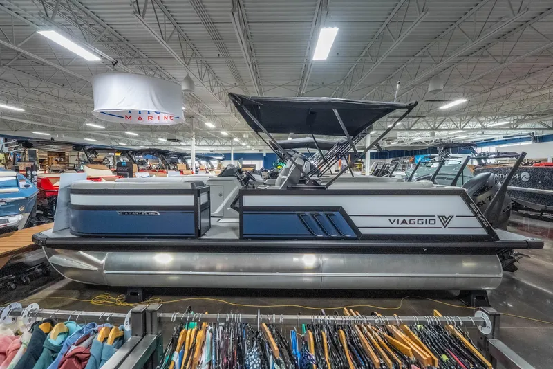 Slide: The Image of 2026 Viaggio D22U pontoon boat displayed indoors, showcasing sleek design and modern features. - 33