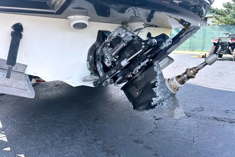 Slide: The Image of Damaged propeller of a 2006 Sea Ray 260 Sundancer boat on asphalt surface. - 14