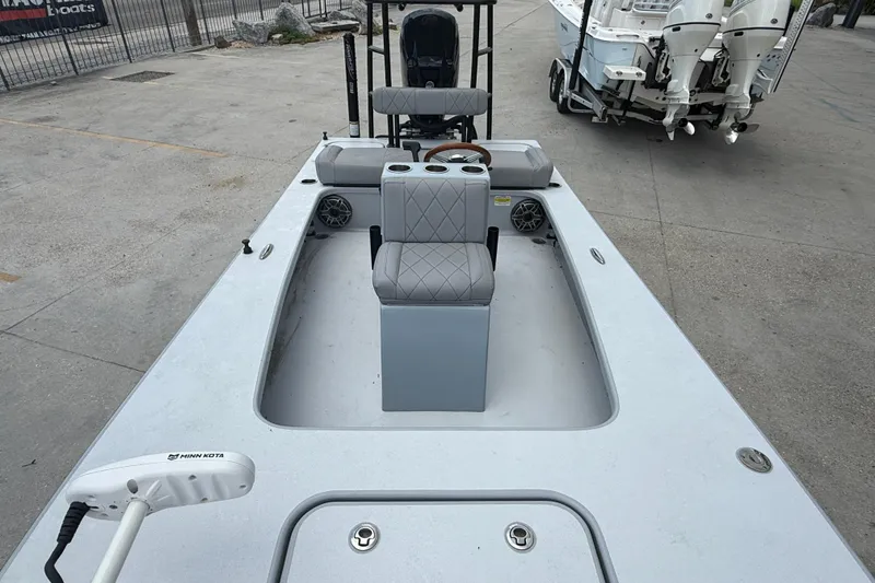 Slide: The Image of 2023 ZCB Curlew 18 boat with gray seating and Minn Kota trolling motor. - 10