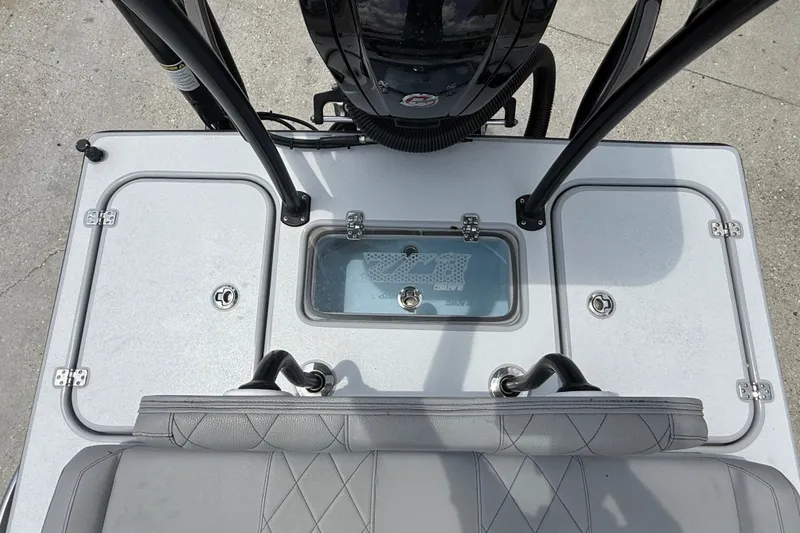 Slide: The Image of 2023 ZCB Curlew 18 boat deck with storage compartments and seating. - 13