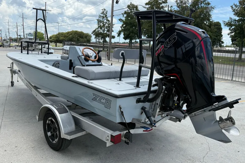 Slide: The Image of 2023 ZCB Curlew 18 boat on trailer with powerful outboard motor. - 5