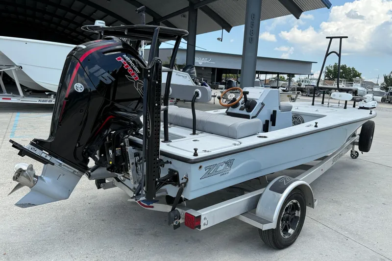Slide: The Image of 2023 ZCB Curlew 18 boat with Mercury 115 Pro XS engine, parked on a trailer. - 7