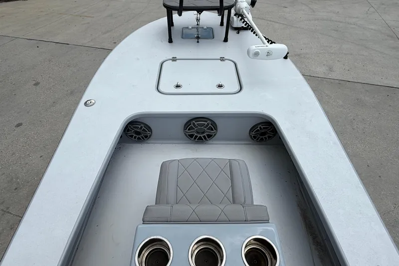 Slide: The Image of 2023 ZCB Curlew 18 boat deck with seating, cup holders, and speakers. - 9