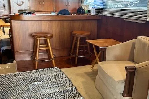 Slide: The Image of Interior of 1984 Post 43 Sport Fisherman with wooden bar, stools, and cozy seating area. - 11