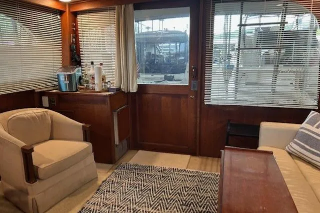 Slide: The Image of Interior of 1984 Post 43 Sport Fisherman yacht with cozy seating and wooden accents. - 12