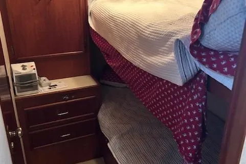 Slide: The Image of 1984 Post 43 Sport Fisherman cabin with bunk beds and wooden cabinetry. - 14