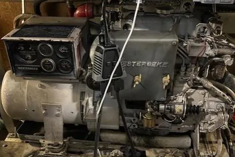 Slide: The Image of 1984 Post 43 Sport Fisherman engine room with Westerbeke generator and control panel. - 18