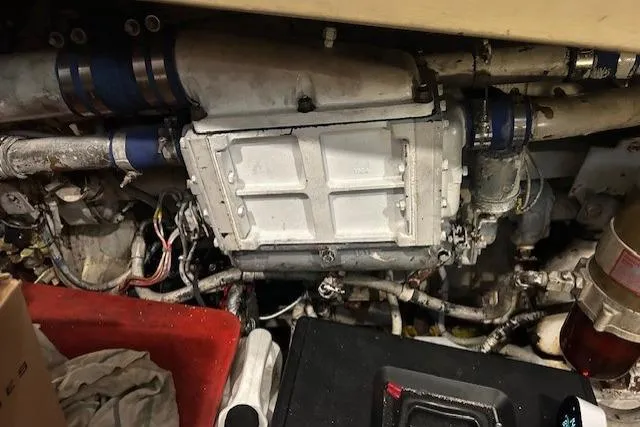 Slide: The Image of Engine compartment of a 1984 Post 43 Sport Fisherman boat, showing mechanical components and wiring. - 19