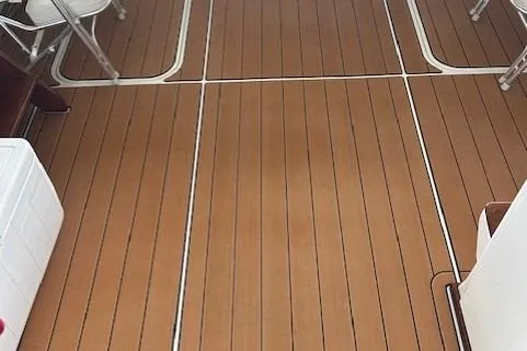 Slide: The Image of 1984 Post 43 Sport Fisherman boat deck with teak flooring and seating. - 6