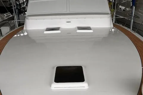 Slide: The Image of 1984 Post 43 Sport Fisherman boat deck with hatch and wooden trim. - 9