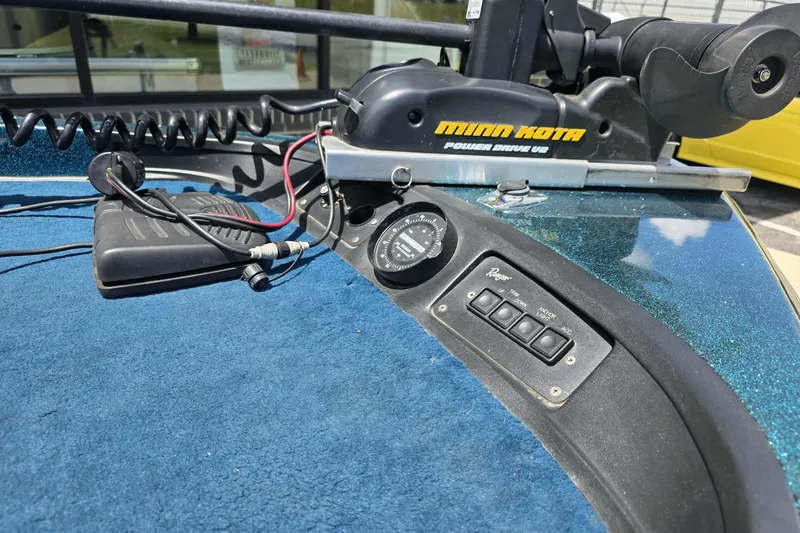 Slide: The Image of 1994 Ranger 482 V boat dashboard with Minn Kota Power Drive V2 motor controls. - 3