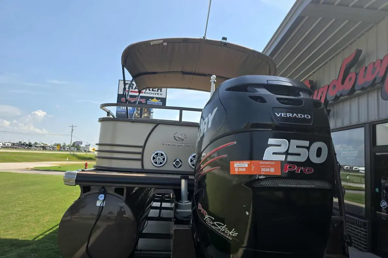 Slide: The Image of 2015 Regency 254 LE3 pontoon boat with Mercury 250 Pro engine at dealership. - 8