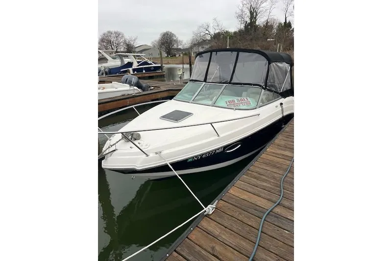 The Image of 2012 Chaparral 225 SSi boat docked, with "For Sale" sign displayed. - 0