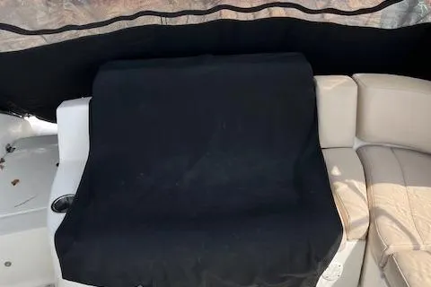 Slide: The Image of 2012 Chaparral 225 SSi boat interior with covered seating area. - 10