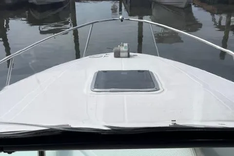 Slide: The Image of 2012 Chaparral 225 SSi boat bow view at marina. - 14