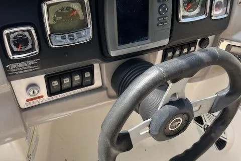 Slide: The Image of Dashboard of 2012 Chaparral 225 SSi boat with steering wheel and gauges. - 16