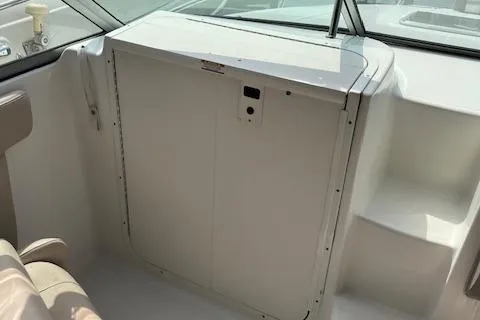 Slide: The Image of 2012 Chaparral 225 SSi boat interior with seating and storage compartment. - 8