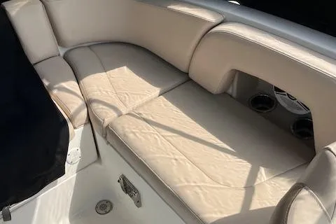 Slide: The Image of 2012 Chaparral 225 SSi boat interior with beige leather seating. - 9