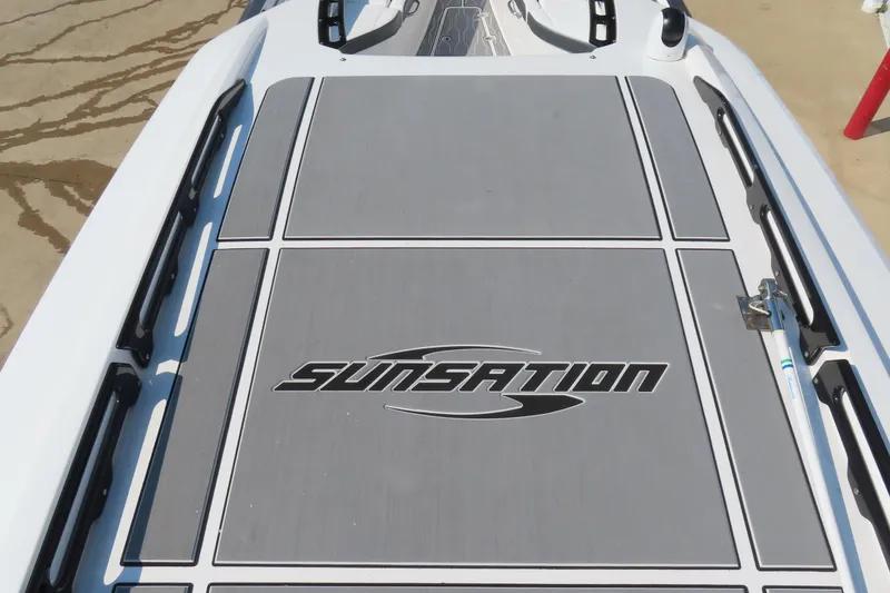Slide: The Image of 2021 Sunsation 34 CCX boat deck with logo, featuring sleek design and modern aesthetics. - 10